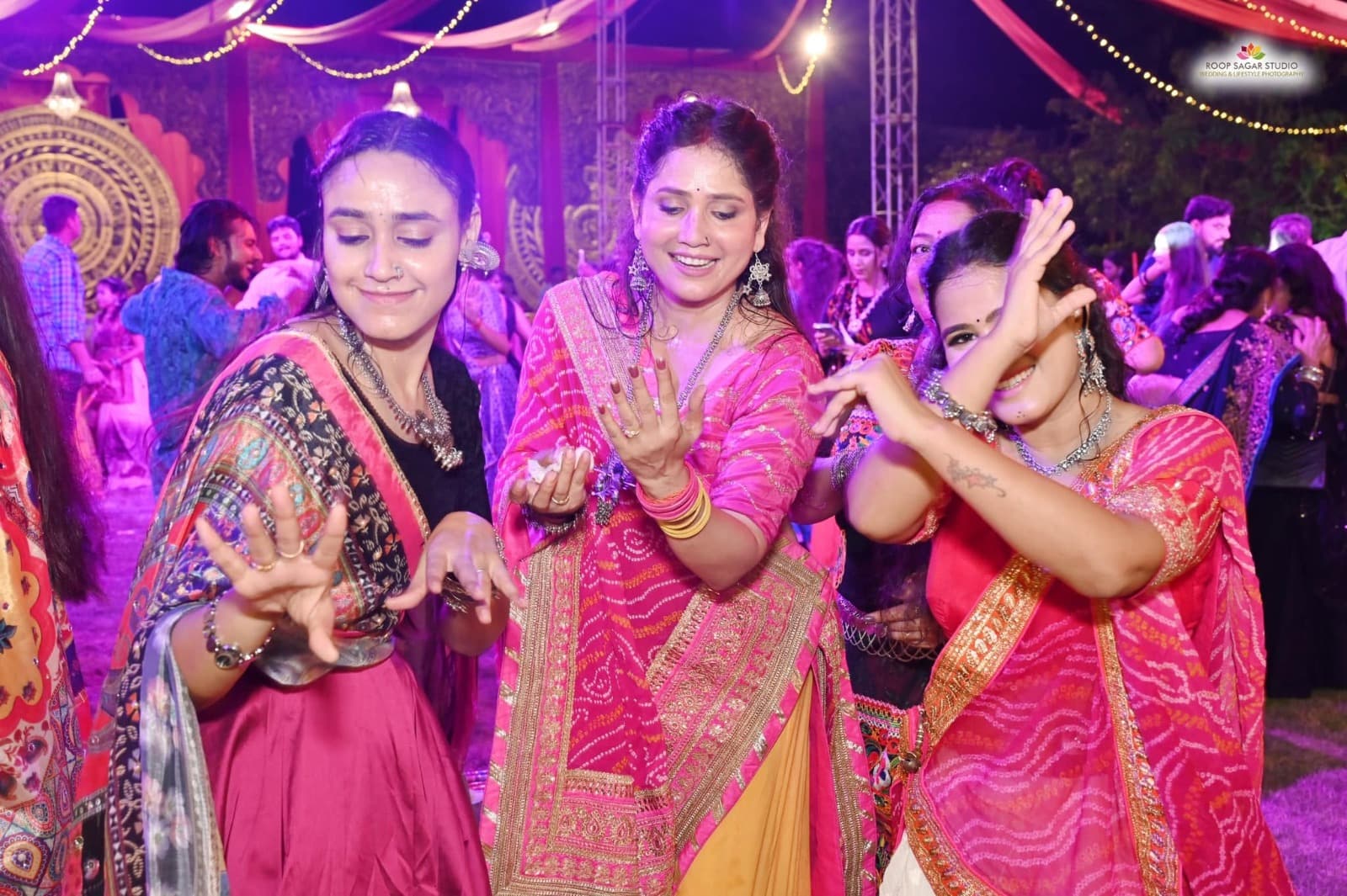 Guests dancing together during a colourful dandiya night at Adarsh Vatika